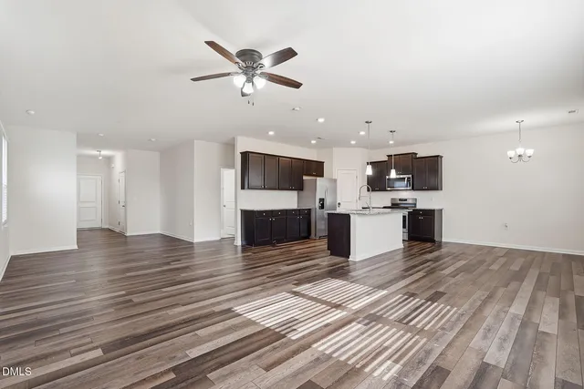 a view of a kitchen with a stove cabinets and wooden floor