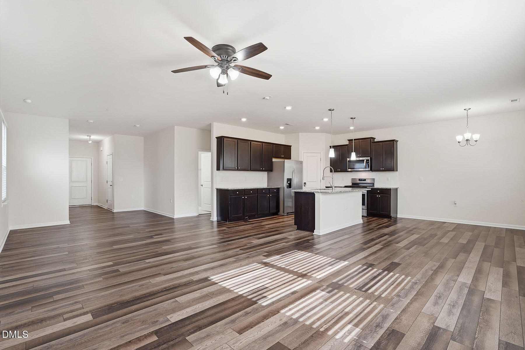 2116 Water Marsh Trail Fuquay-Varina, NC 27526 - Photo 7 of 28 a view of a kitchen with a stove cabinets and wooden floor