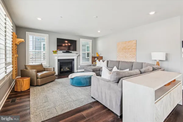 a bedroom with furniture and a wooden floor