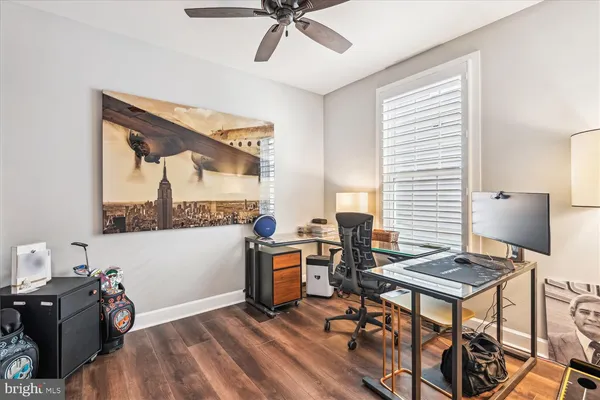 a spacious bedroom with a bed and a book shelf