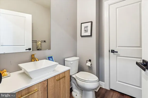 a view of walk in closet with clothes