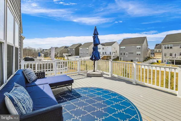 a bedroom with furniture and wooden floor