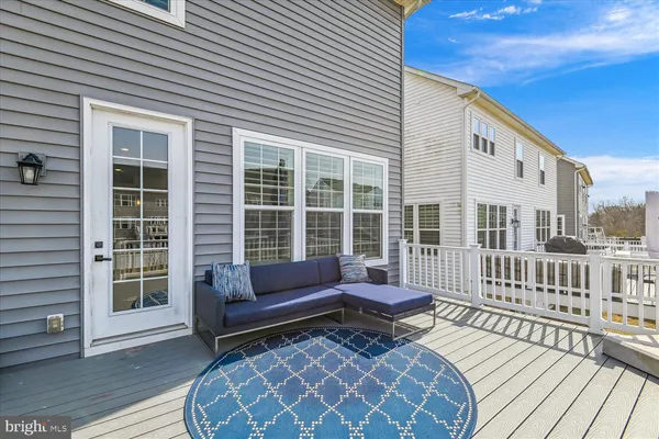 a bathroom with a granite countertop sink mirror vanity and toilet