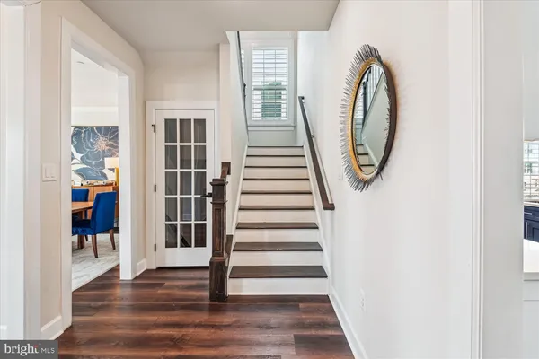 a bedroom with a bed and a lamp