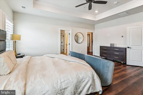 a living room with furniture gym equipment and a large window