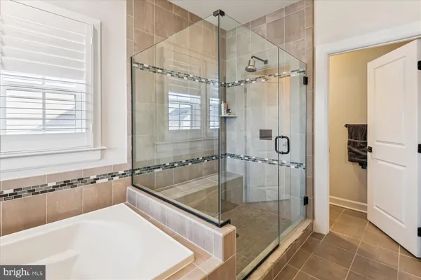 a bedroom with a bed and a dresser in it