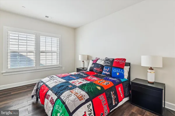 a view of a patio with dining table and chairs