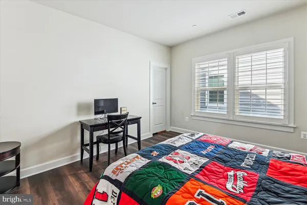 a living room with furniture or couch and a wooden floor