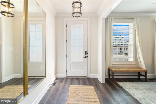 a view of a hallway view with wooden floor and staircase