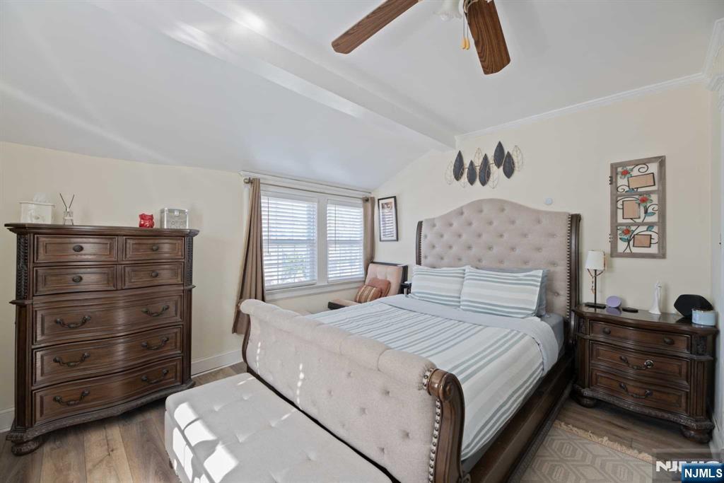 10 Trinity Place Kearny, NJ 07032 - Photo 17 of 30 a bedroom with a bed and a dresser