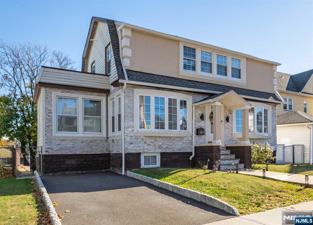 10 Trinity Place Kearny, NJ 07032 - Photo 2 of 30 a front view of a house with swimming pool