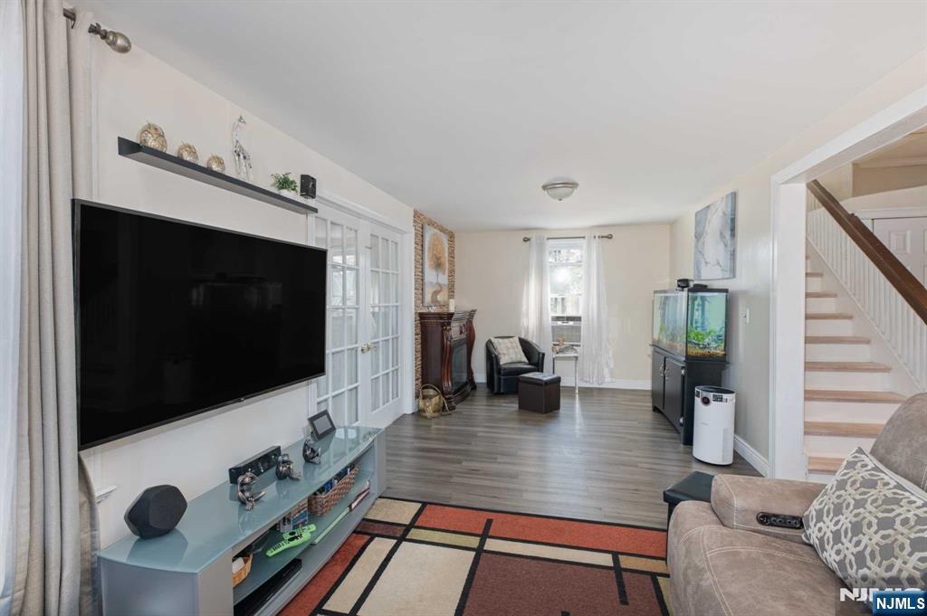10 Trinity Place Kearny, NJ 07032 - Photo 7 of 30 a living room with furniture and a flat screen tv