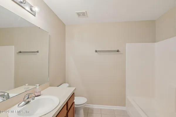 a bathroom with a sink toilet and vanity