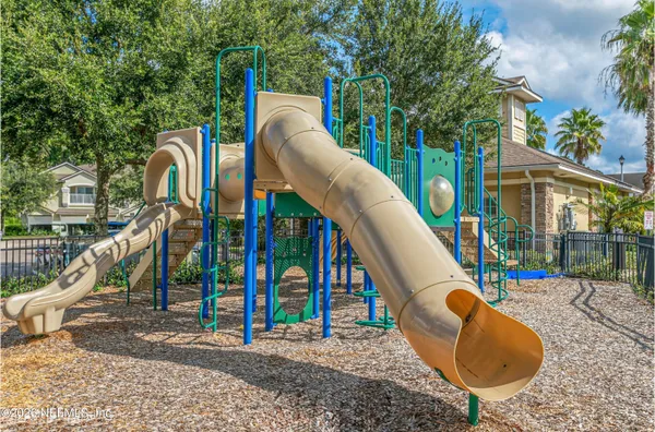 a view of outdoor space with swimming pool and seating