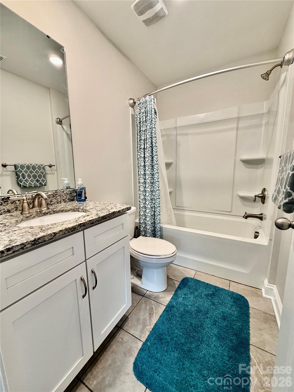 1220 Pecan Ridge Road Fort Mill, SC 29715 - Photo 17 of 25 a bathroom with a sink a toilet a mirror and bathtub
