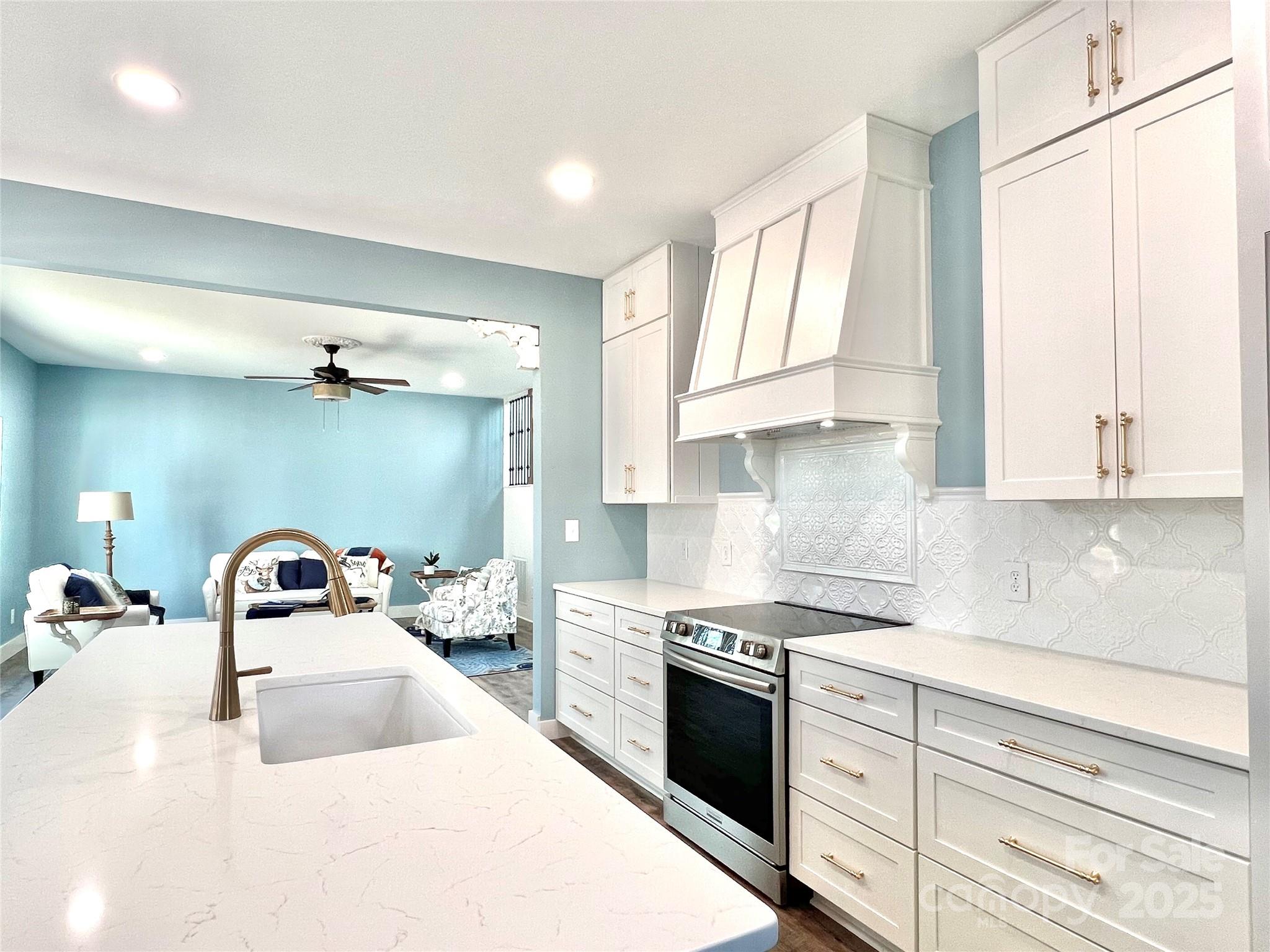 122 Arrowood Lane Harmony, NC 28634 - Photo 11 of 47 a kitchen with granite countertop a sink stainless steel appliances and cabinets