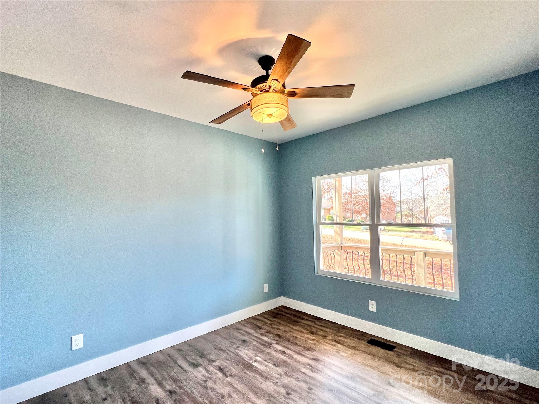 122 Arrowood Lane Harmony, NC 28634 - Photo 17 of 47 a view of an empty room with window and cabinet