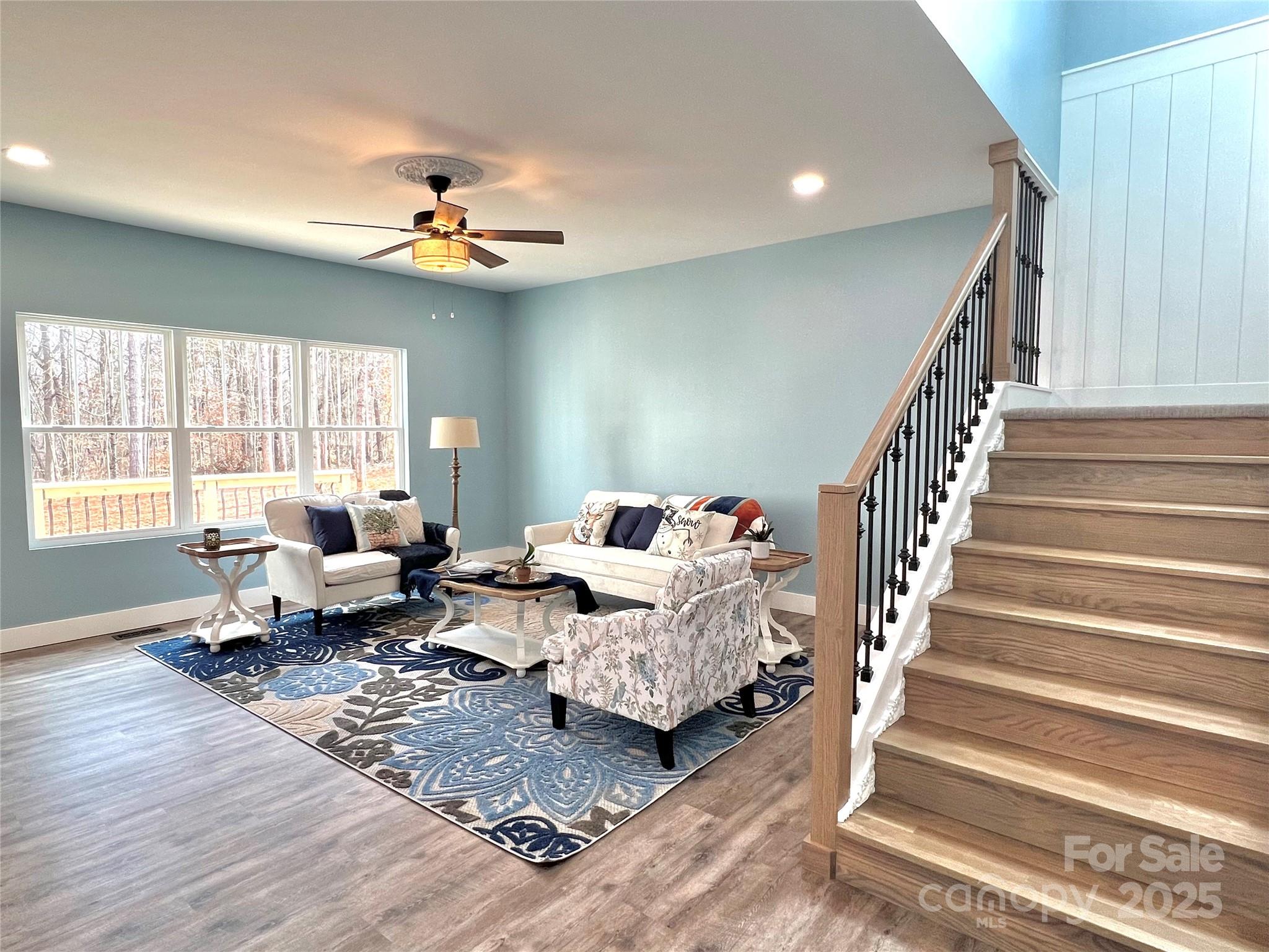 122 Arrowood Lane Harmony, NC 28634 - Photo 18 of 47 a living room with furniture chandelier and a window