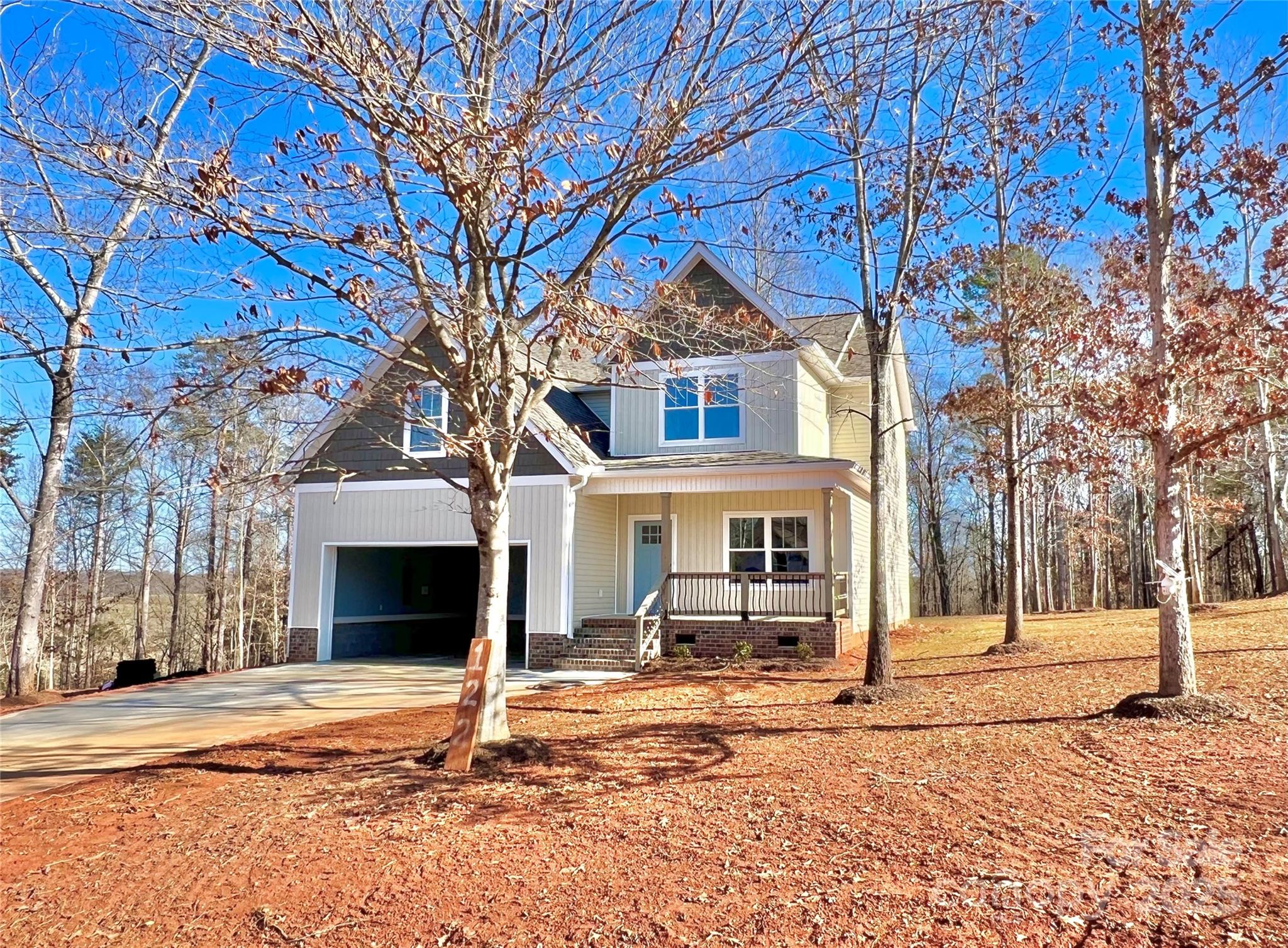 122 Arrowood Lane Harmony, NC 28634 - Photo 47 of 47 a house with trees in front of it