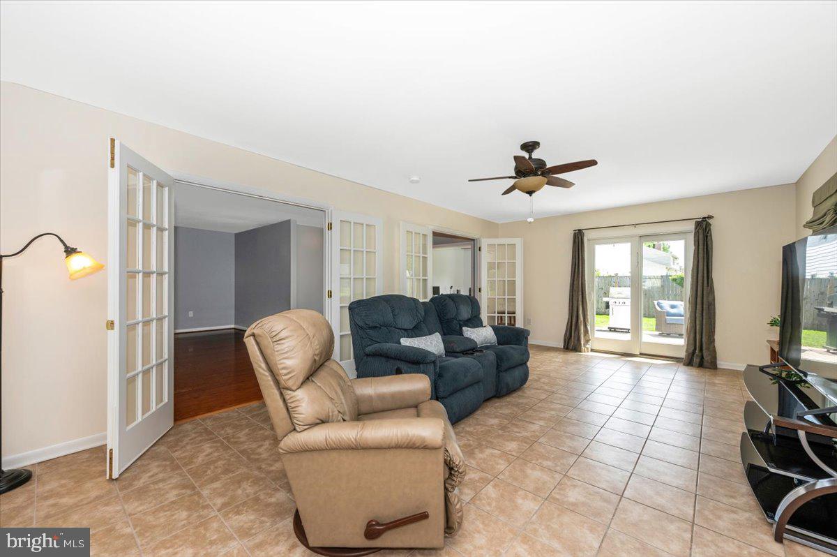 17400 Hughes Road Poolesville, MD 20837 - Photo 26 of 101 a living room with furniture and a flat screen tv