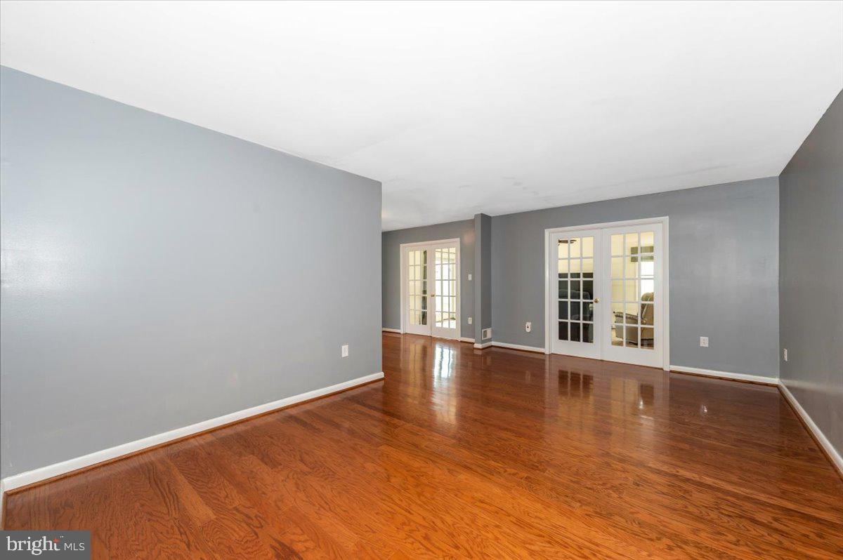 17400 Hughes Road Poolesville, MD 20837 - Photo 8 of 101 a view of empty room with wooden floor and fan