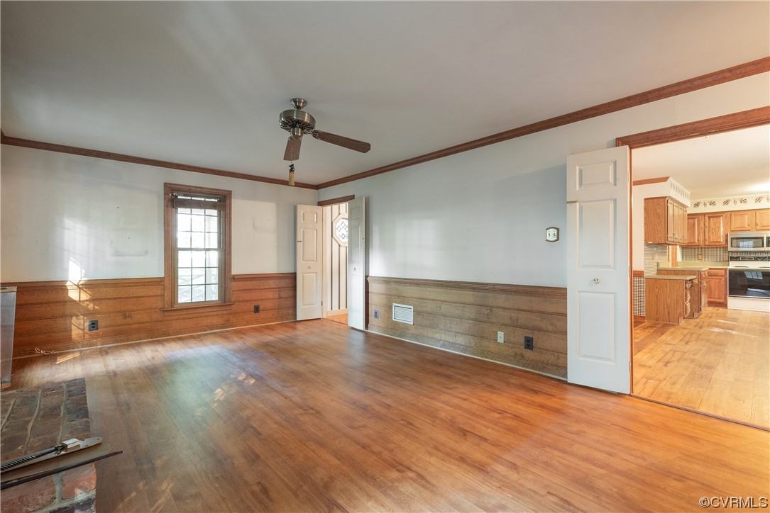 341 Rossmere Drive Midlothian, VA 23114 - Photo 13 of 35 an empty room with wooden floor and windows