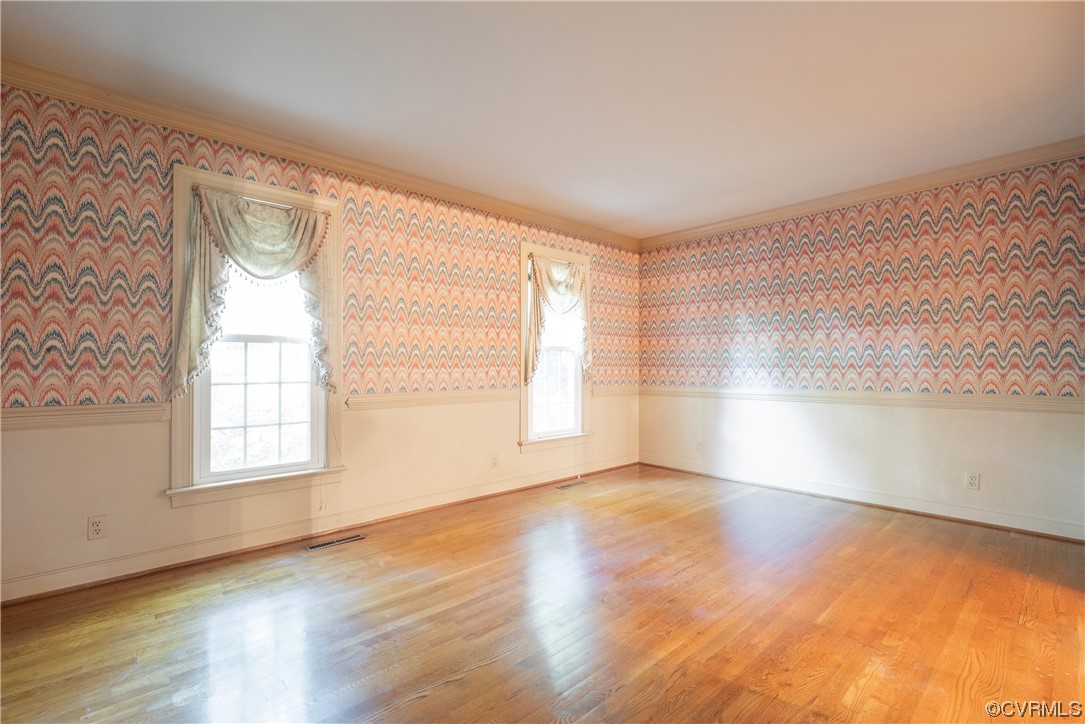 341 Rossmere Drive Midlothian, VA 23114 - Photo 14 of 35 an empty room with wooden floor and windows