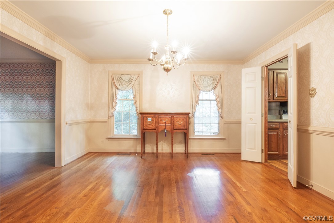 341 Rossmere Drive Midlothian, VA 23114 - Photo 16 of 35 a view of a room with wooden floor a ceiling fan and windows