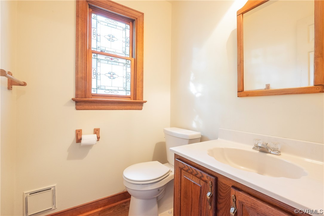 341 Rossmere Drive Midlothian, VA 23114 - Photo 18 of 35 a bathroom with a sink a toilet and a mirror