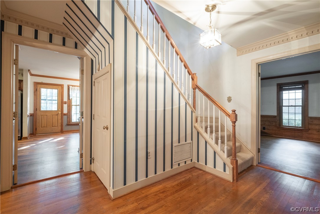 341 Rossmere Drive Midlothian, VA 23114 - Photo 20 of 35 a view of a hallway with wooden floor and stairs