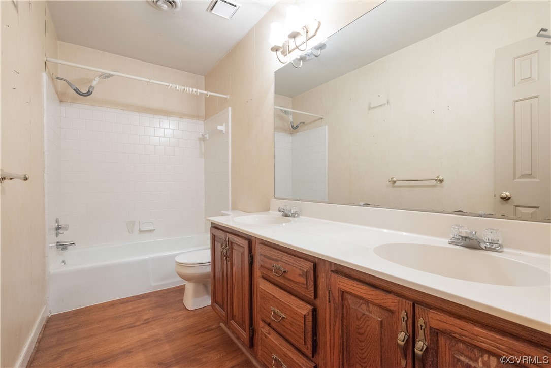 341 Rossmere Drive Midlothian, VA 23114 - Photo 27 of 35 a bathroom with a granite countertop sink a toilet a mirror and shower