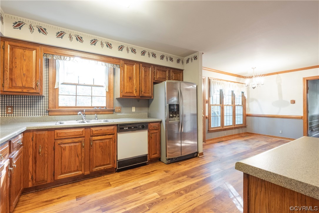 341 Rossmere Drive Midlothian, VA 23114 - Photo 5 of 35 a kitchen with stainless steel appliances granite countertop a refrigerator and wooden cabinets