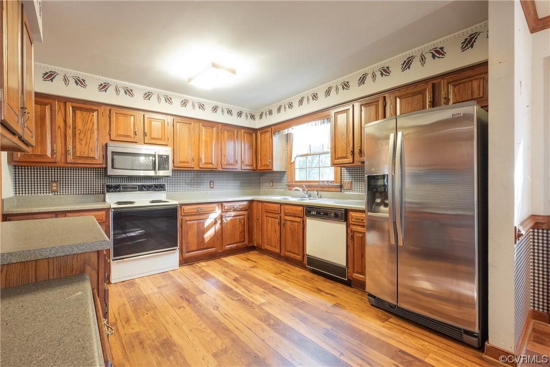 341 Rossmere Drive Midlothian, VA 23114 - Photo 8 of 35 a kitchen with stainless steel appliances granite countertop a refrigerator a stove top oven a sink and dishwasher