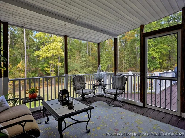a kitchen with granite countertop white cabinets and stainless steel appliances