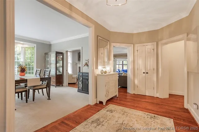 a living room with furniture fireplace and flat screen tv