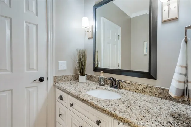 an aerial view of a house with swimming pool a yard and a yard