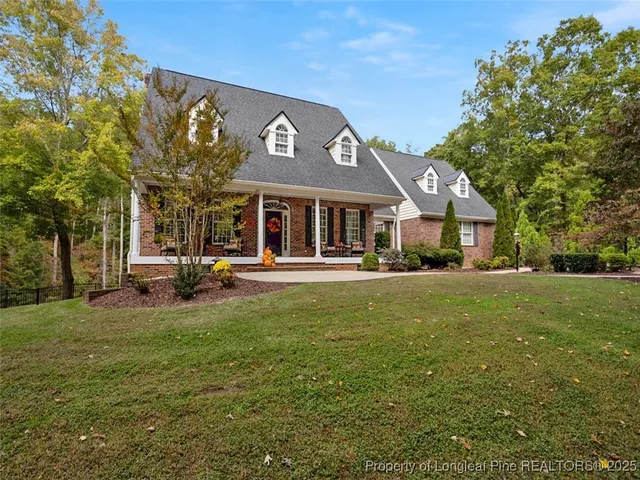 a view of a house with sitting area and furniture