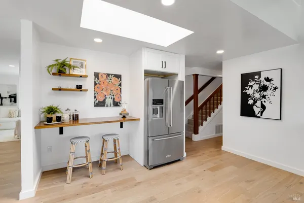 a bathroom with a sink vanity and a mirror