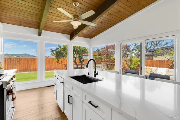 a kitchen with stainless steel appliances refrigerator and microwave