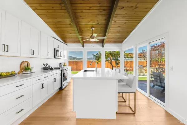 a bedroom with a bed and a potted plant