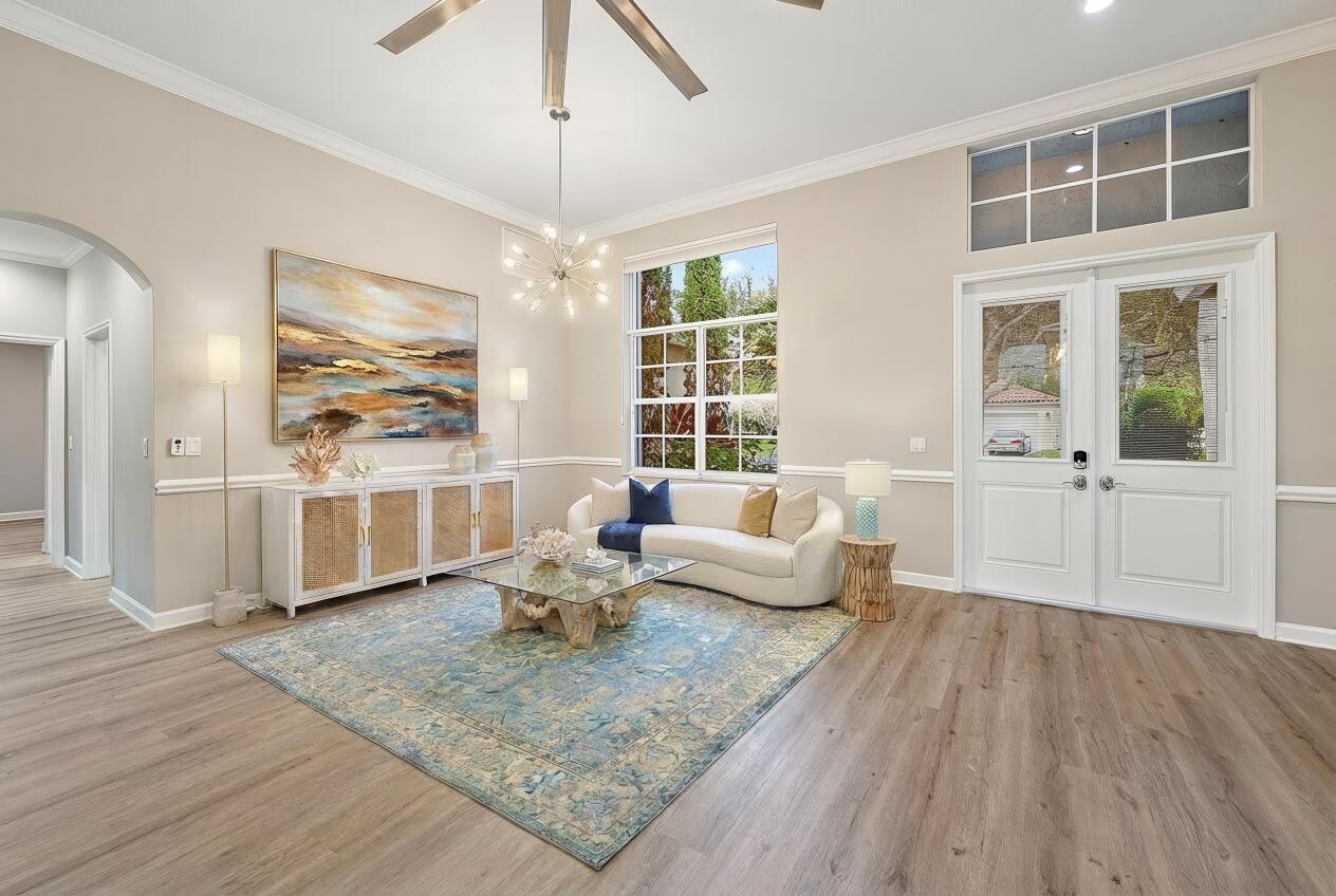 9790 Southeast Crape Myrtle Court Hobe Sound, FL 33455 - Photo 21 of 74 a living room with furniture and wooden floor