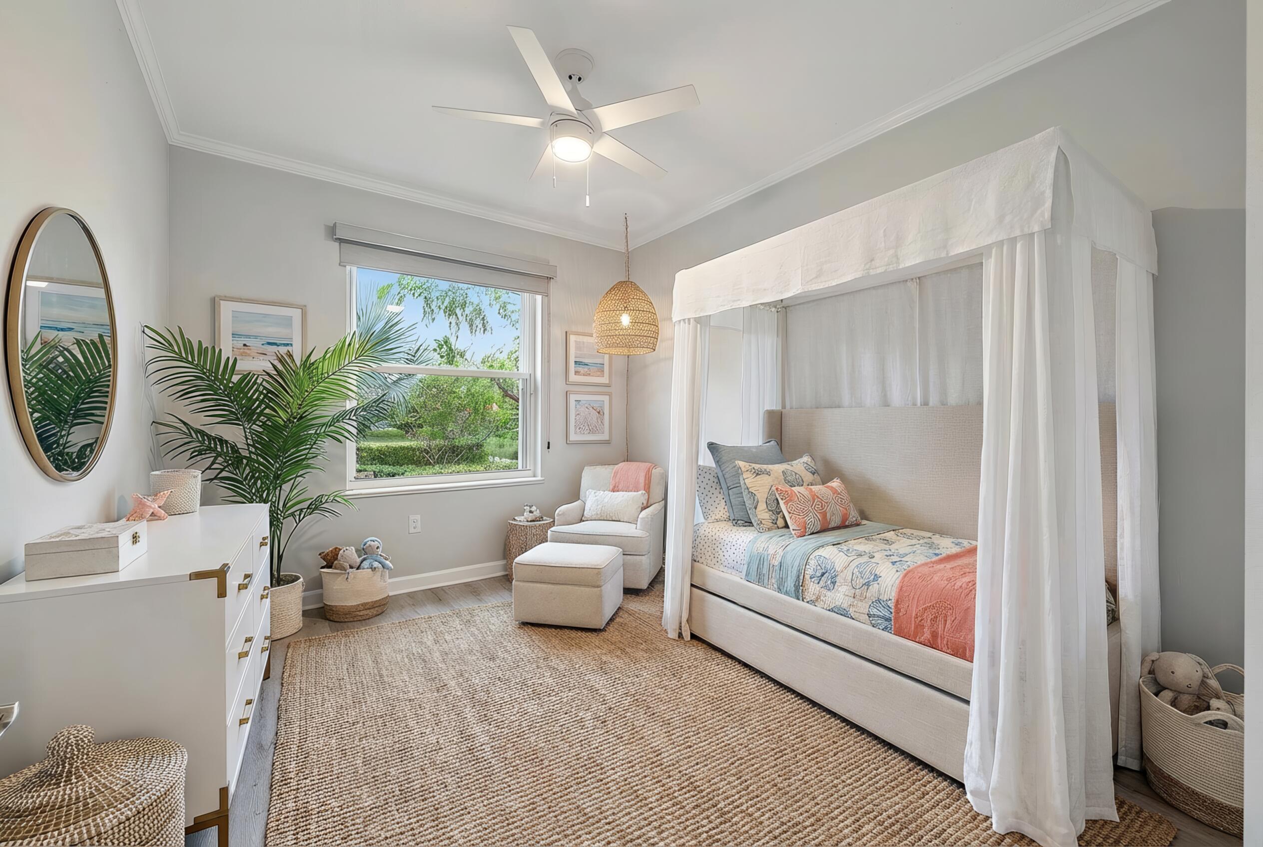 9790 Southeast Crape Myrtle Court Hobe Sound, FL 33455 - Photo 27 of 74 a bedroom with furniture and a large window