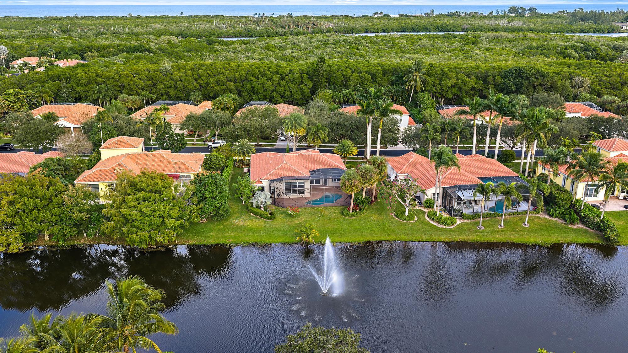 9790 Southeast Crape Myrtle Court Hobe Sound, FL 33455 - Photo 33 of 74 a view of a lake with houses
