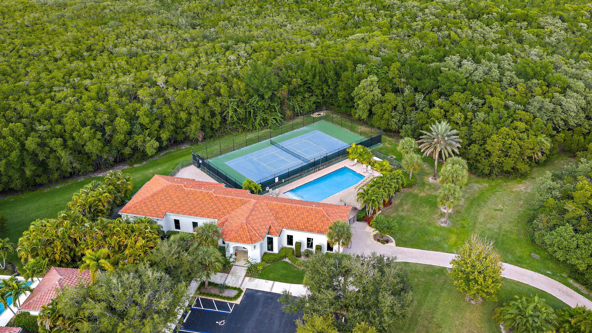 9790 Southeast Crape Myrtle Court Hobe Sound, FL 33455 - Photo 35 of 74 an aerial view of a house with pool outdoor seating and yard