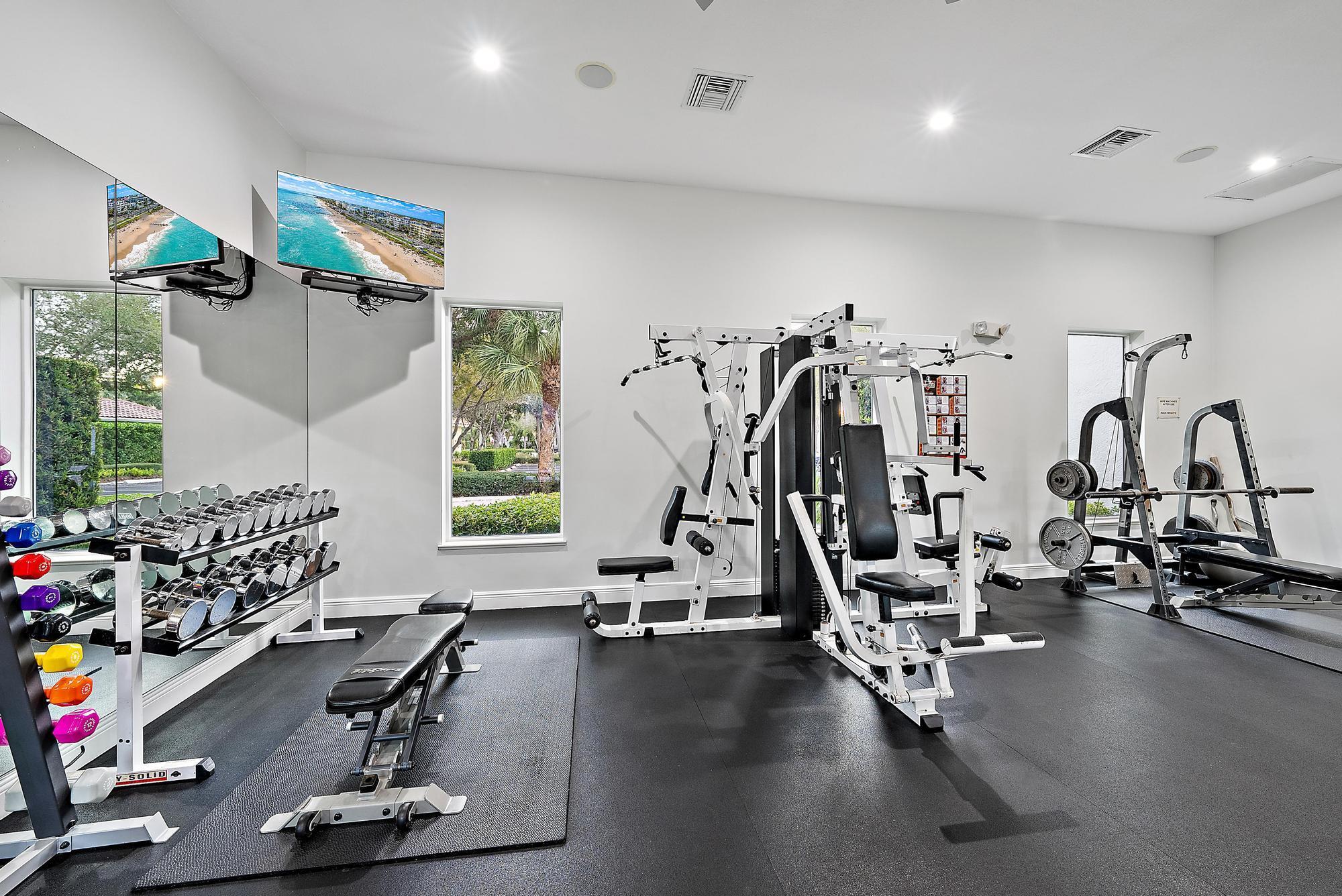 9790 Southeast Crape Myrtle Court Hobe Sound, FL 33455 - Photo 39 of 74 a view of a room with gym equipment