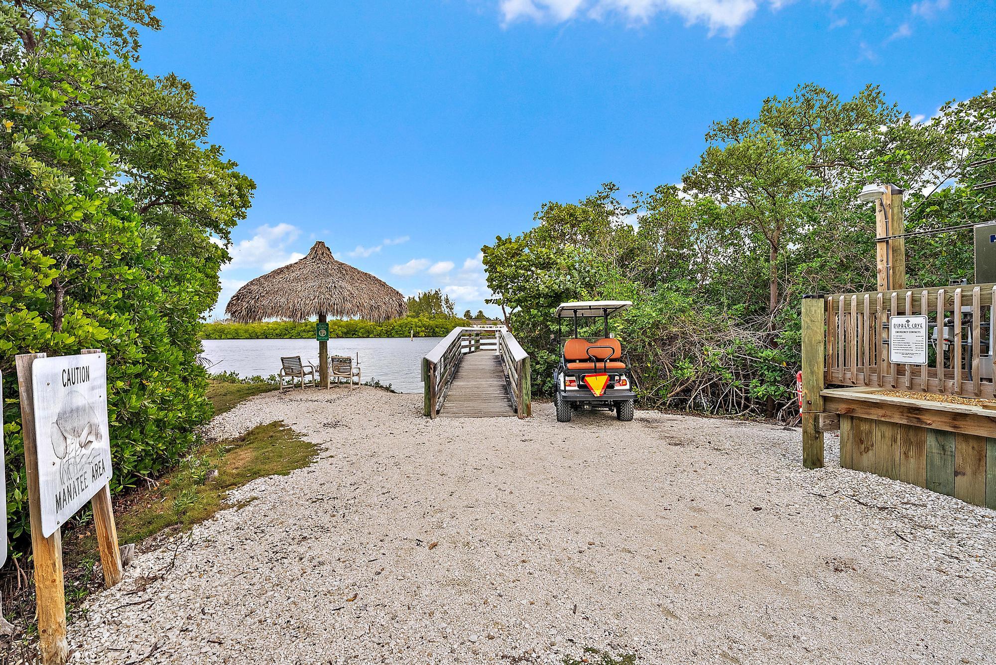 9790 Southeast Crape Myrtle Court Hobe Sound, FL 33455 - Photo 45 of 74 a view of a house with backyard and sitting area