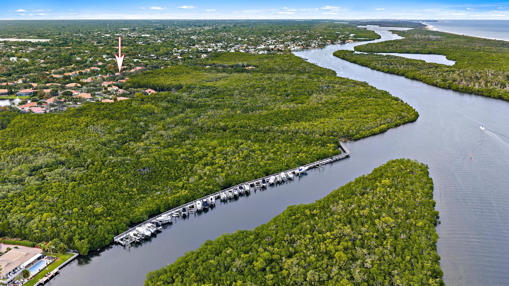 9790 Southeast Crape Myrtle Court Hobe Sound, FL 33455 - Photo 8 of 74 a view of a green field with lots of green space