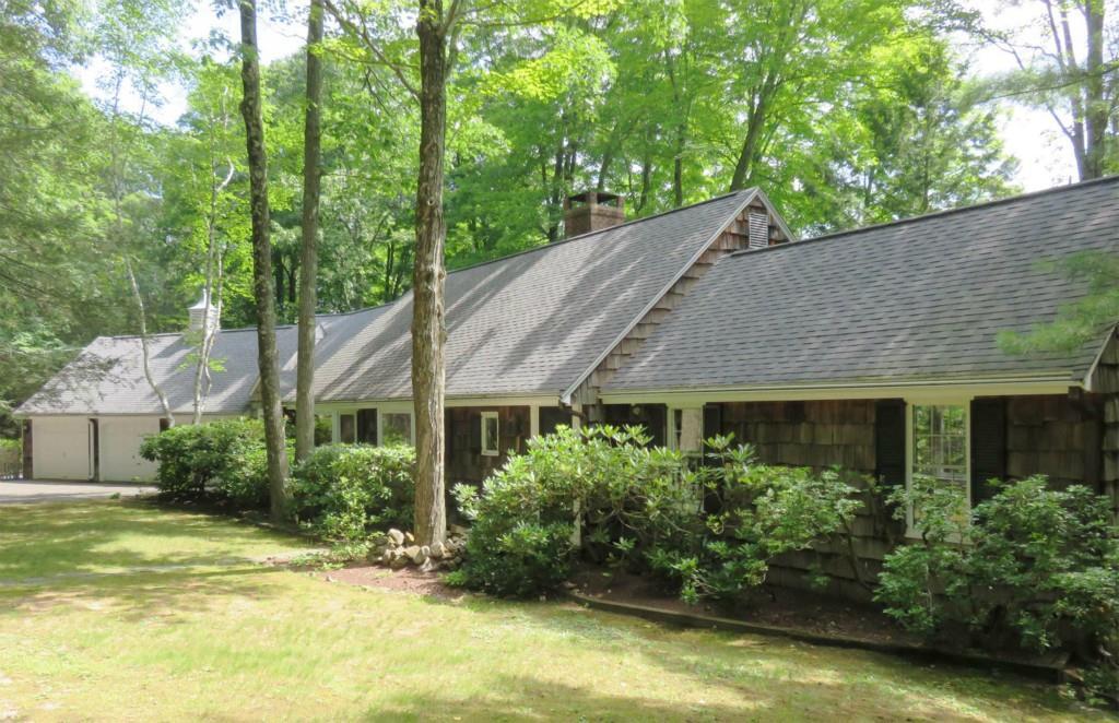 a house with a tree in the background