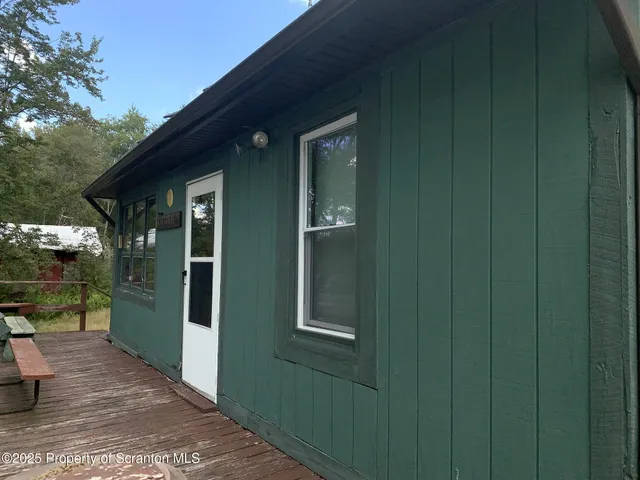 a sitting area with furniture on the deck