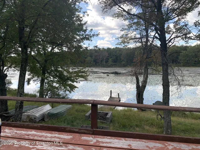 a house with trees in the background